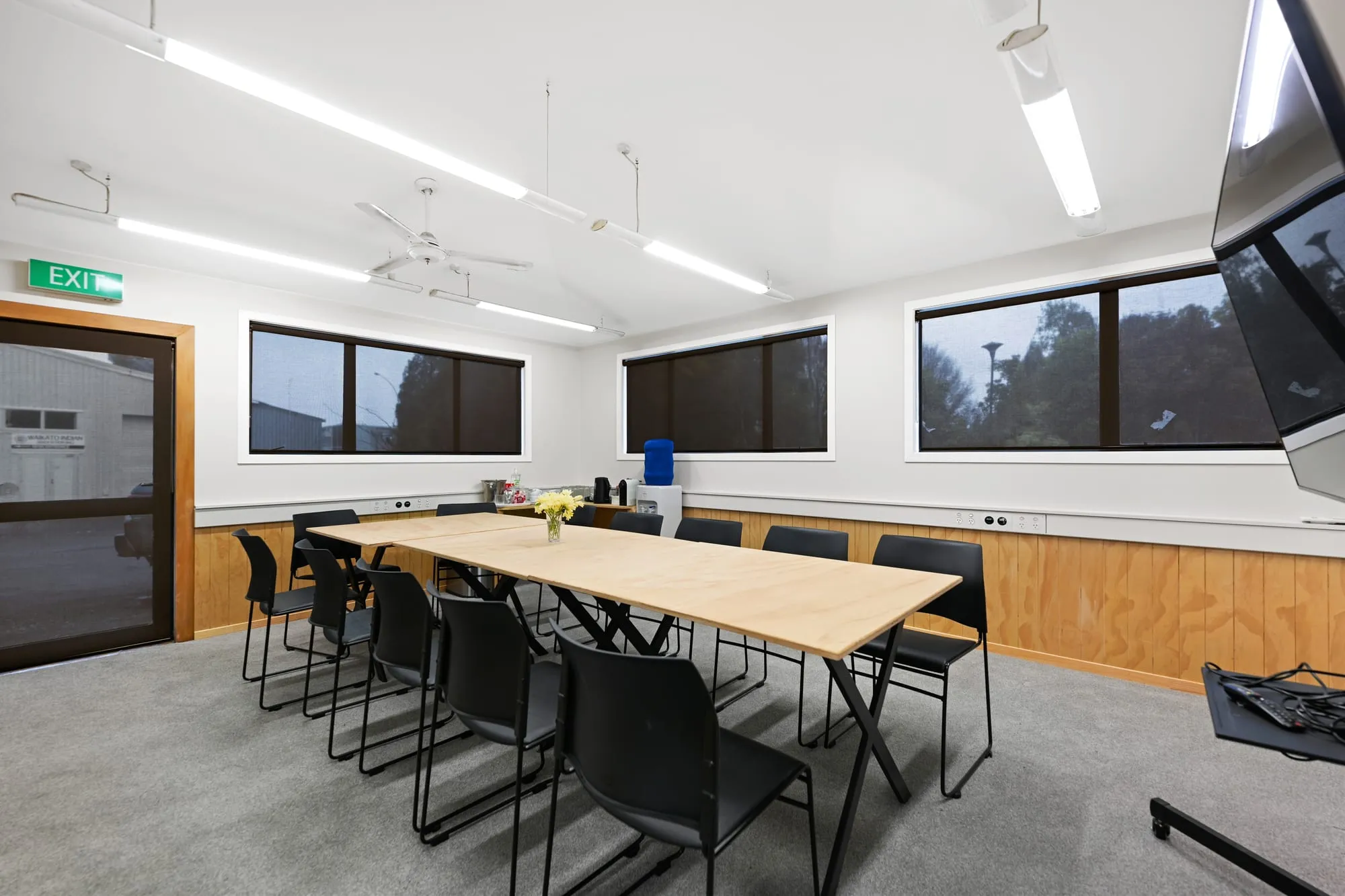 Three modular tables and chairs in the meeting room, with natural light from the windows