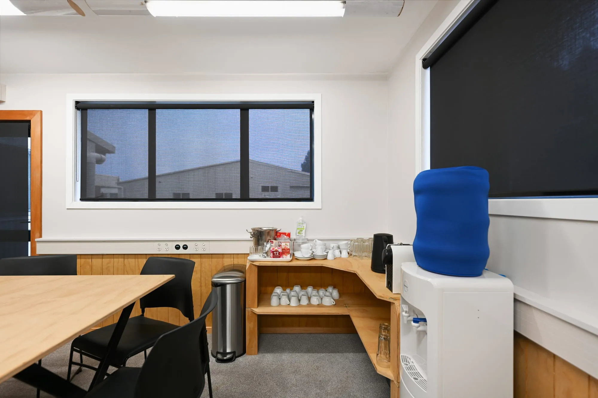 The tea, coffee and water station in the corner of the meeting room