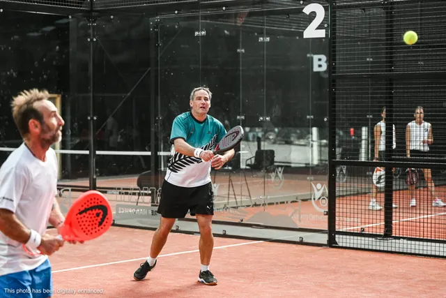Two players on Court 2 waiting for the ball to drop
