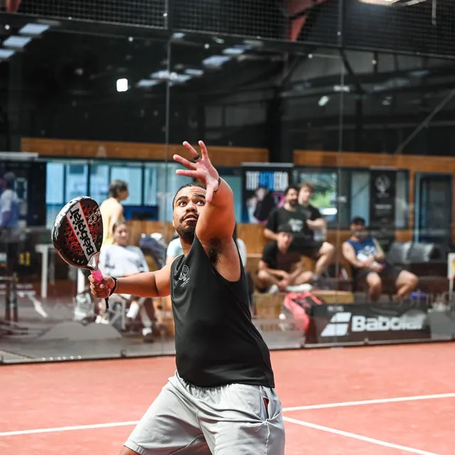 Ben, our head coach, coiled for a forehand in front of the crowd