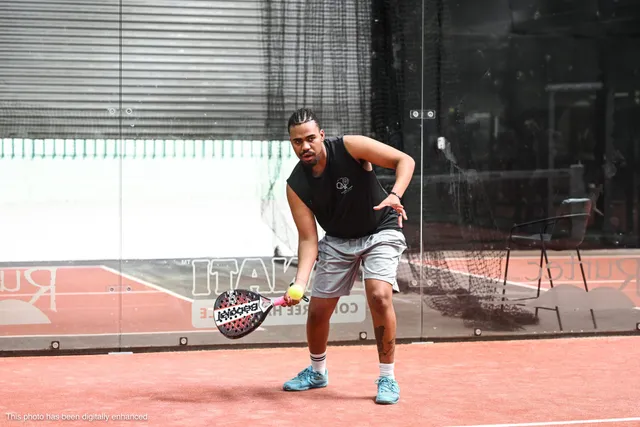 Ben, our head coach, bending low for a forehand