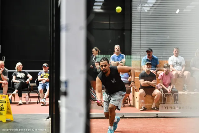 Ben, our head coach, stepping into a low shot with spectators behind
