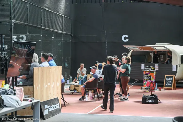 Spectators and players around Court C between matches