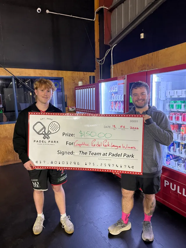 The Park League winners holding up their prize cheque