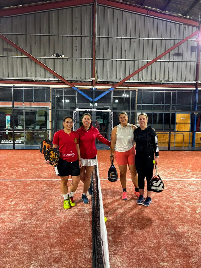 Four players walking off court after a game