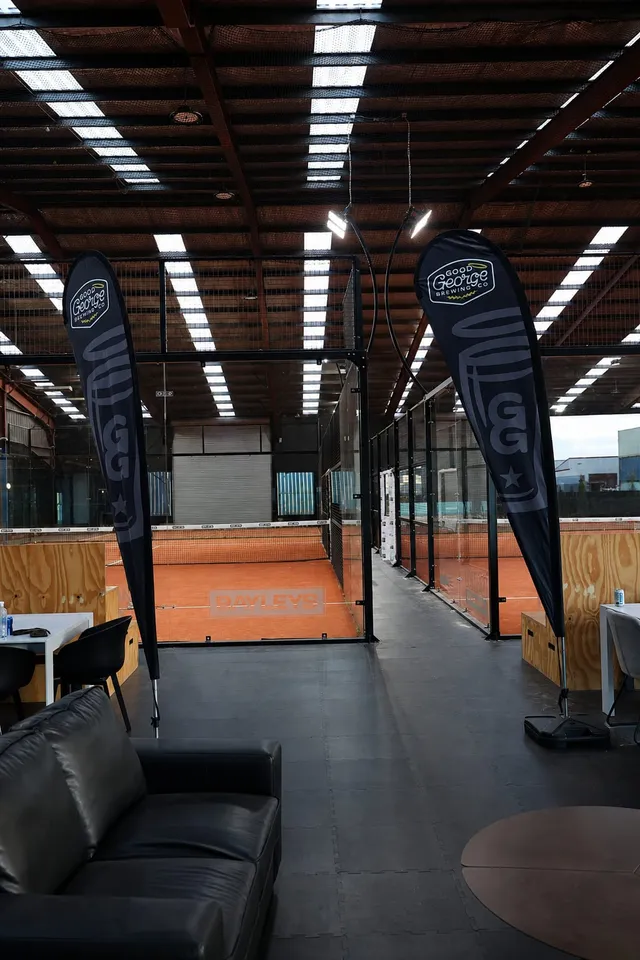 The lounge beside the courts set up with event banners