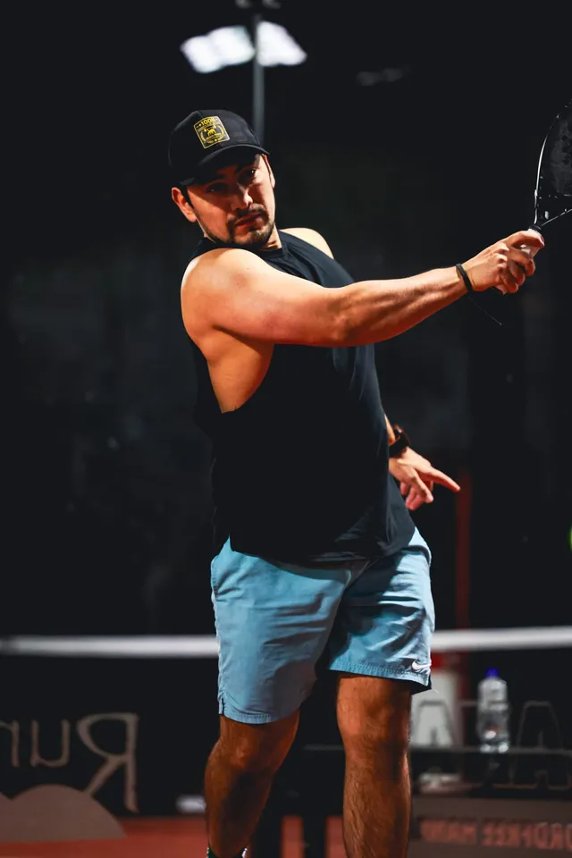 A player playing a backhand volley