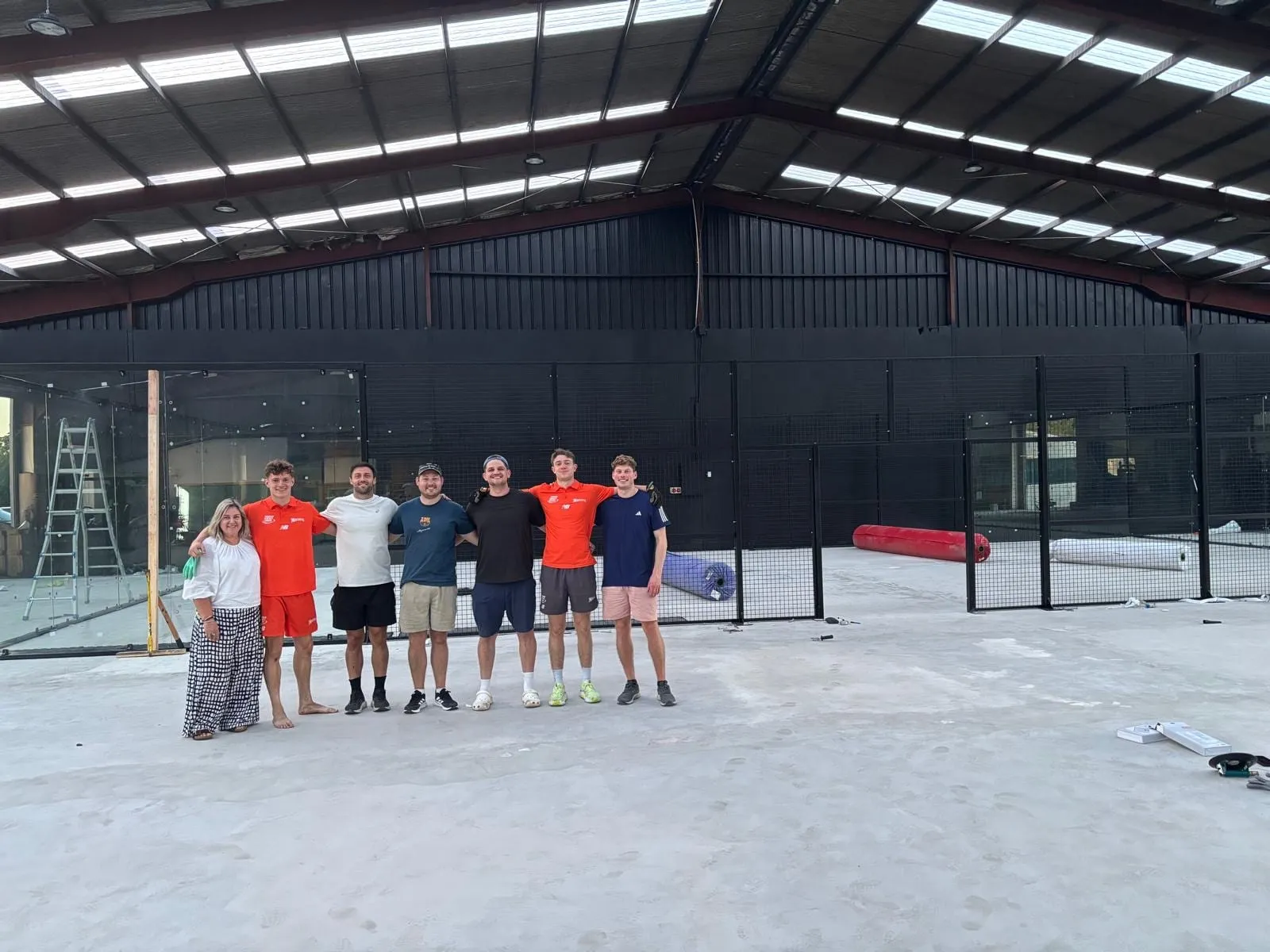 The build crew on the bare floor as the first court frames went up