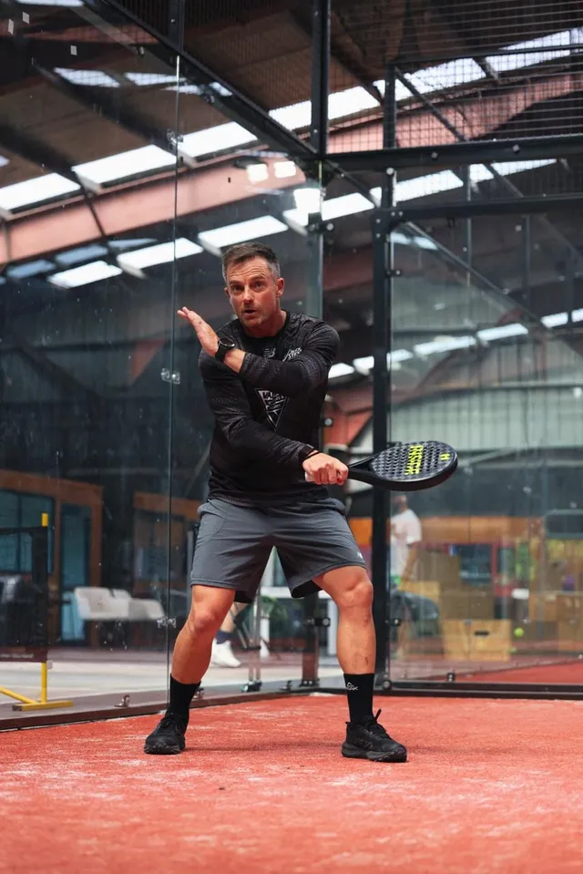 A player bracing for a volley