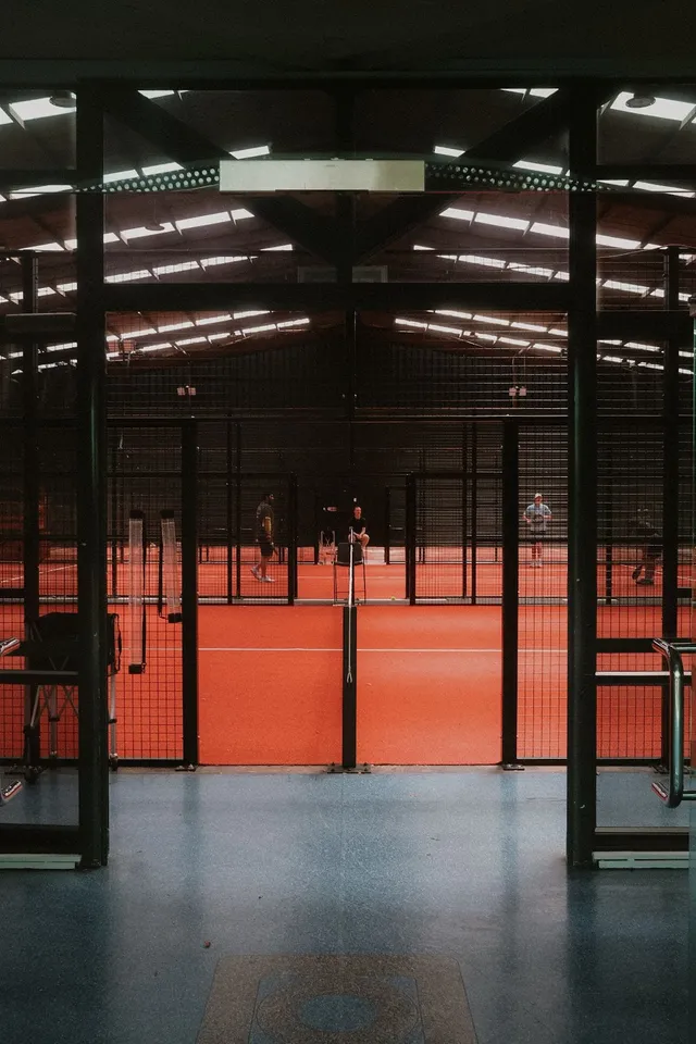 The red courts and glass walls under the roof lights