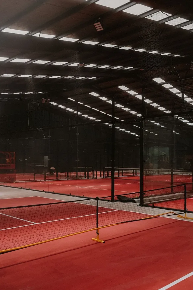 A pickleball court with the net set up